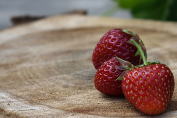 Strawberry fruit on the wooden