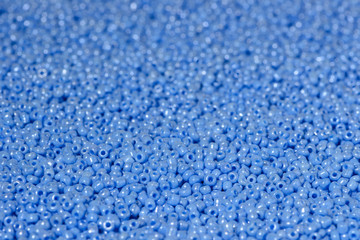 scattered beads of blue color.