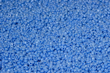 scattered beads of blue color.
