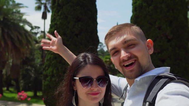 Young happy couple takes a selfie and smiles.