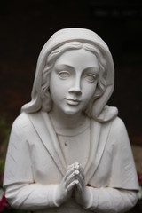 Woman praying garden statue