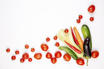 Cherry tomatoes and other vegetables isolated on white background. Top view, Copy space, frame.