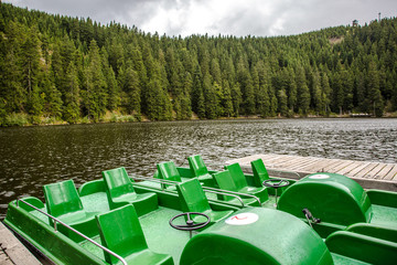 Tourist or fishing boats on a mountain lake