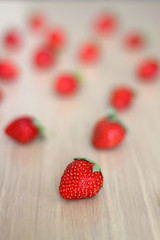 Fresh strawberries on a wooden table. Selective focus.