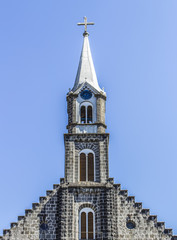 Fototapeta na wymiar Tower of the church Matriz São Pedro, city of Gramado/ RS Brazil. (gaucho saws).