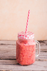 Smoothie in a jar with a straw