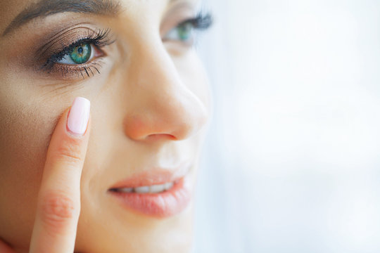 Health and Beauty. Beautiful Young Girl With Green Eyes Holds Contact Lens On Finger. Eye Care. Good Vision Fresh View. High Resolution