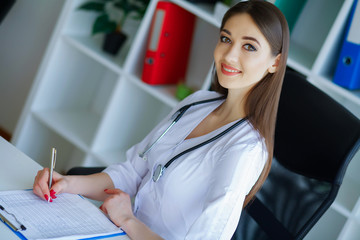 Health. Diet and Healthy. Nutrition. Portrait of a Dietitian's Doctor with Fresh Fruits and...