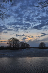 Beautiful scenery sunset on the lake in early spring.