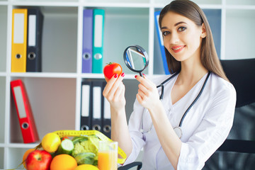 Health. Diet and Healthy. Doctor Dietitian Holding in Hands Fresh Tomatoes and Watch Dandruff....