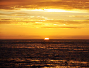 Naklejka na ściany i meble sunset in the North sea off the coast of Iceland from the cruise ship