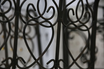 Fototapeta na wymiar Hearts, Hearts, Hearts in an Ironwork Fence
