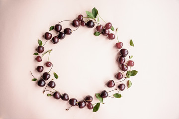 Country style. Frame made of cherry. Seasonal fruits. Summer harvest. Cherry background.