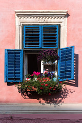 Fototapeta na wymiar Blue Shuttered Window