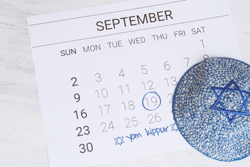 Calendar with kippah. Yom kippur concept.
