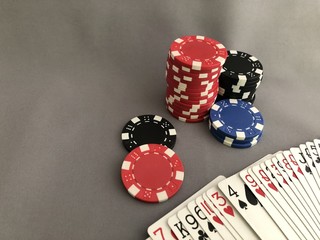 Chips and cards on grey
