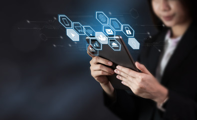 Business woman holding tablet and show sign technology icon. Future Technology Concepts.