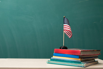 American flag, books, and desk