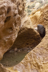 Beautiful landscape of dried salty mountain river with clouds in the sky at La Rambla, La Murada, Orihuela, Spain Mountain area with small river extremely dry and salty. the water created a unique 