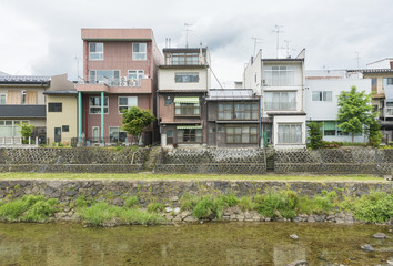 Fototapeta na wymiar residential building and river and Takayama city, Japan