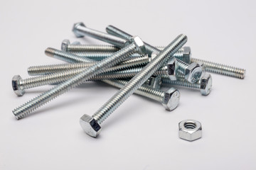Bolt and nuts on a white background