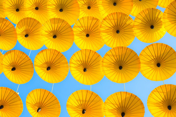 Pattern Yellow umbrellas on blue sky.