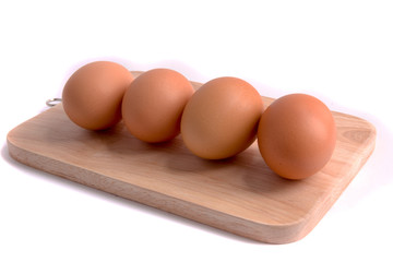 Eggs on a butcher with white background