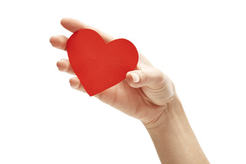 red paper heart in hand isolated on white