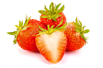 Strawberry fruits whole and cut in half isolated on white background