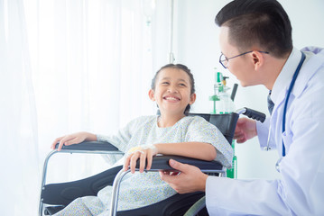 Young asian girl patient smiling while doctor come to visit