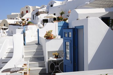 Famous stunning view of white architectures and colorful houses above the volcanic caldera in the...