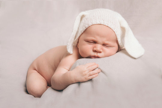 portrait of newborn baby in a hat with ears. Newborn fashion