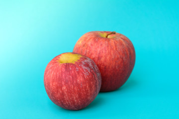Red apple on green background