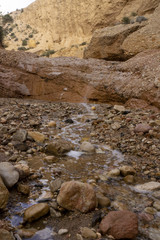 Beautiful landscape of dried salty mountain river with clouds in the sky at La Rambla, La Murada, Orihuela, Spain Mountain area with small river extremely dry and salty. the water created a unique 