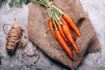 Carrot fresh and beautiful on a background with burlap
