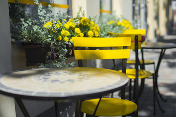 Summer cafe with yellow chairs - 211715486