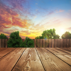 Wooden product table top with blurred outdoor backyard background