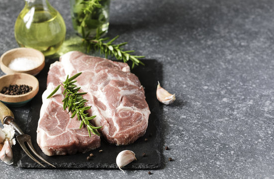 Raw pork meat for grill with ingredients for cooking.