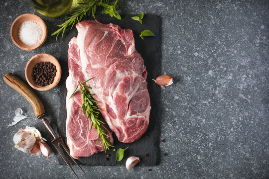 Raw pork meat for grill with ingredients for cooking.