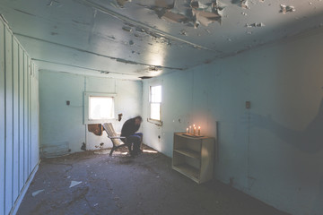 man rocking back and forth out of fear hearing voices depression and alone