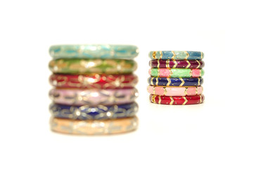 Stack of gold bangle with vivid color and rhinestone isolated on white background