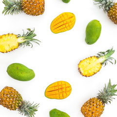 Food frame of pineapple and mango fruits on white background. Flat lay, top view. Tropical concept.