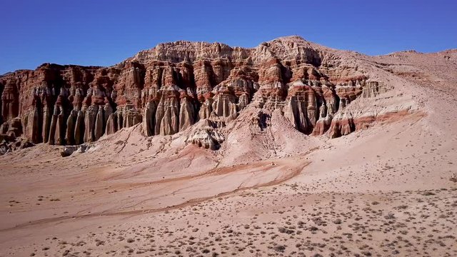 Drone flying by Aird Red Rock Ridge with Exposed Cliffside