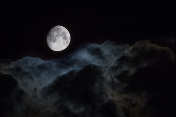 Obraz na płótnie Canvas Cloudy Moon in the Night Sky