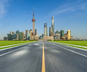 city road through modern buildings in shanghai