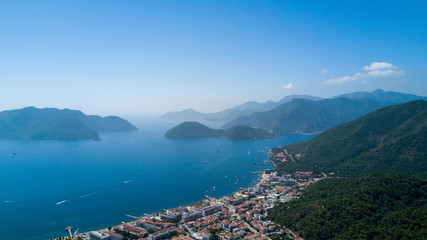 Fototapeta na wymiar Aerial photo of Marmaris bay with beautiful mountains and island on the background, a lot of yacht and sailboat