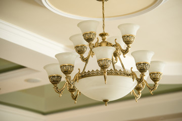 Vintage luxury chandelier in antique style in elegant interior closeup