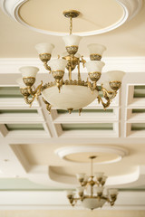 Vintage luxury chandelier in antique style in elegant interior closeup