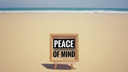 Motivational and inspirational quote - ‘Peace of mind’ written on a framed paper. With vintage styled background.