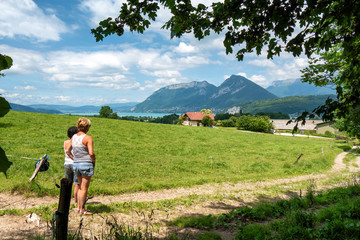 Fototapeta na wymiar two women looking at Annecy lake in France